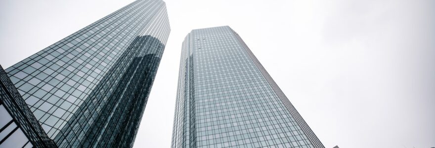 a couple of tall buildings sitting next to each other