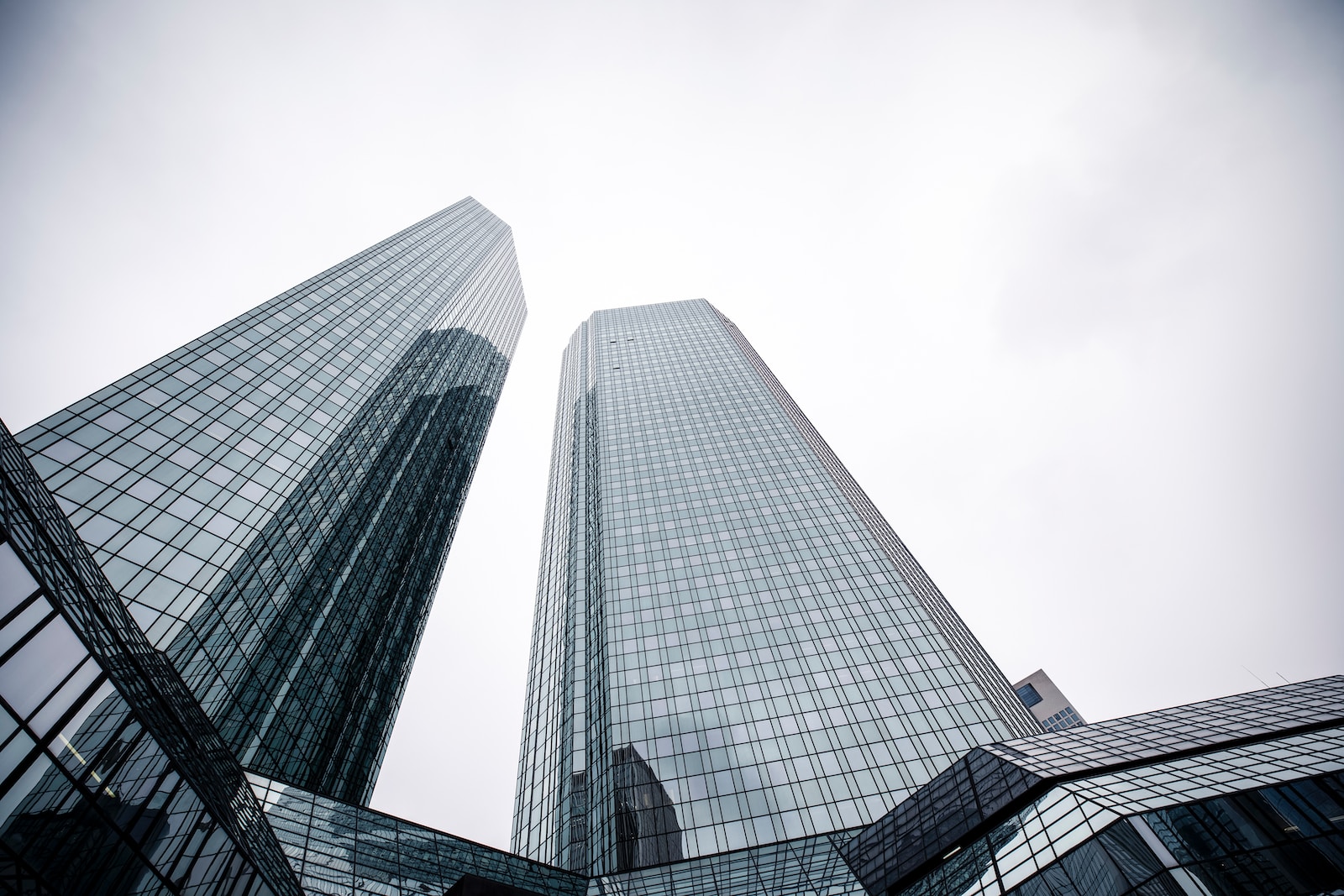 a couple of tall buildings sitting next to each other